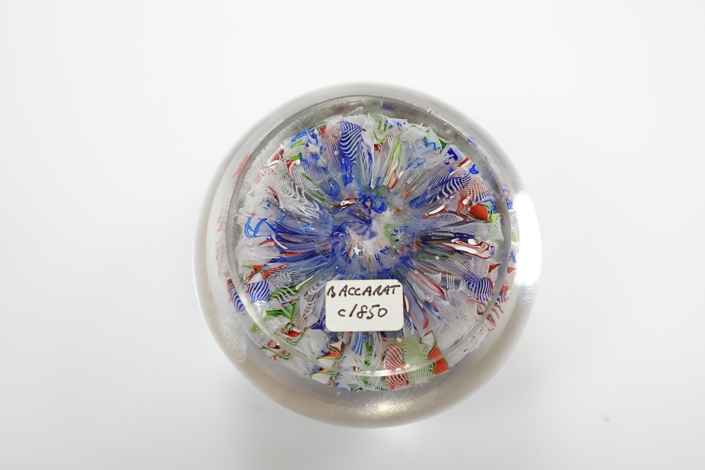 A Baccarat scrambled glass paperweight, 7.5cm in diameter